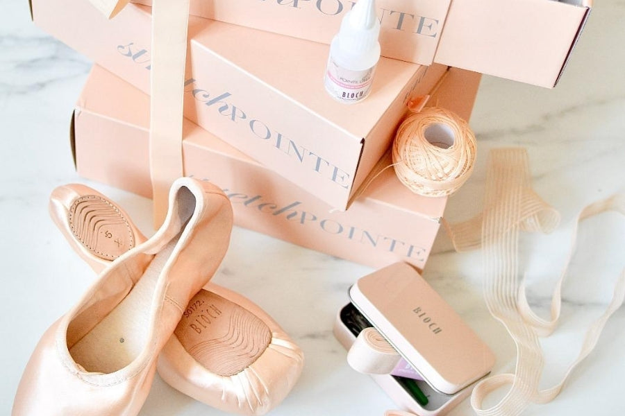 BLOCH Pointe Shoes Accessories in pink tin next to BLOCH Pointe Shoes